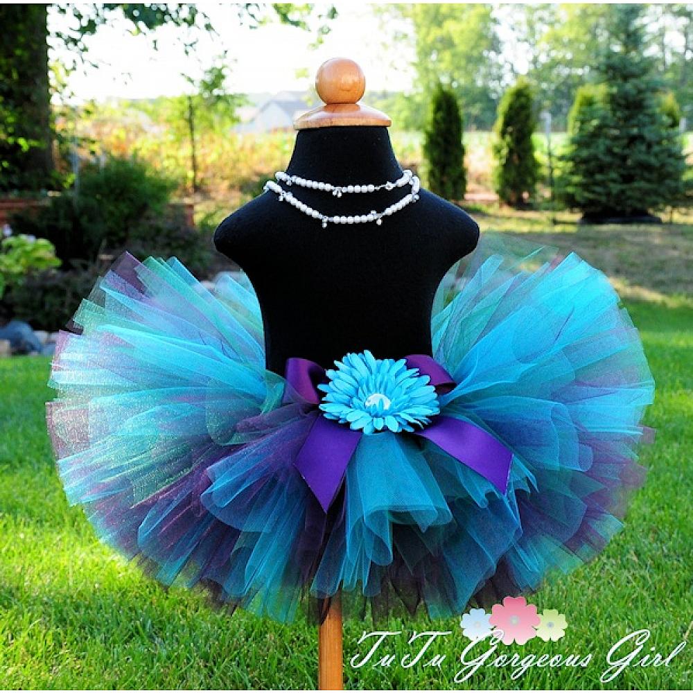 Turquoise stretch velvet tutu with beaded tulle embellishments.